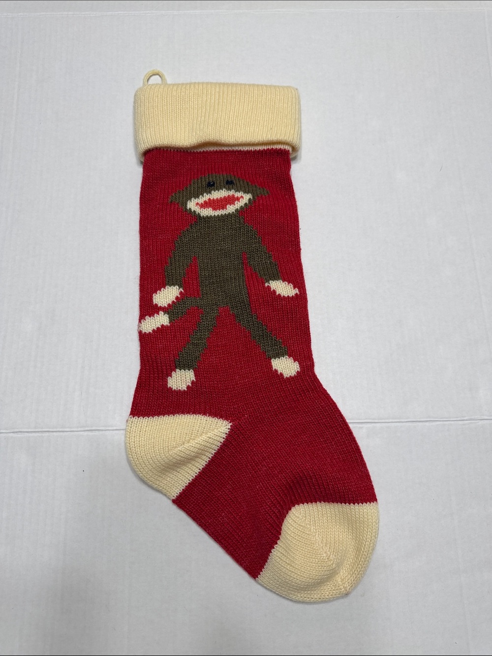Red Knit Holiday Stocking with Cream Cuff and Sock Monkey Motif
